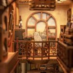 assemble-your-own-enchanted-book-nook-with-instruments assembling a miniature book nook kit with tiny guitars and shelf props