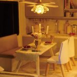assembled-tiny-apartment-diorama-featuring-clock-and-cozy-furnishings Assembled Time Apartment miniature diorama with clock face, warm LED glow, and atmospheric vintage decor