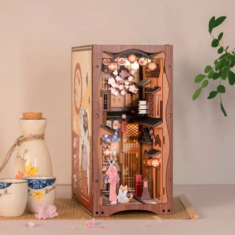 cherry-blossom-bookshelf-insert-with-fairy-lights cherry blossom bookshelf insert with warm fairy lights glowing between books