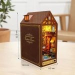 collectible-book-nook-diorama-featuring-half-timbered-facades Collectible book nook diorama with detailed half-timbered Alsatian facades