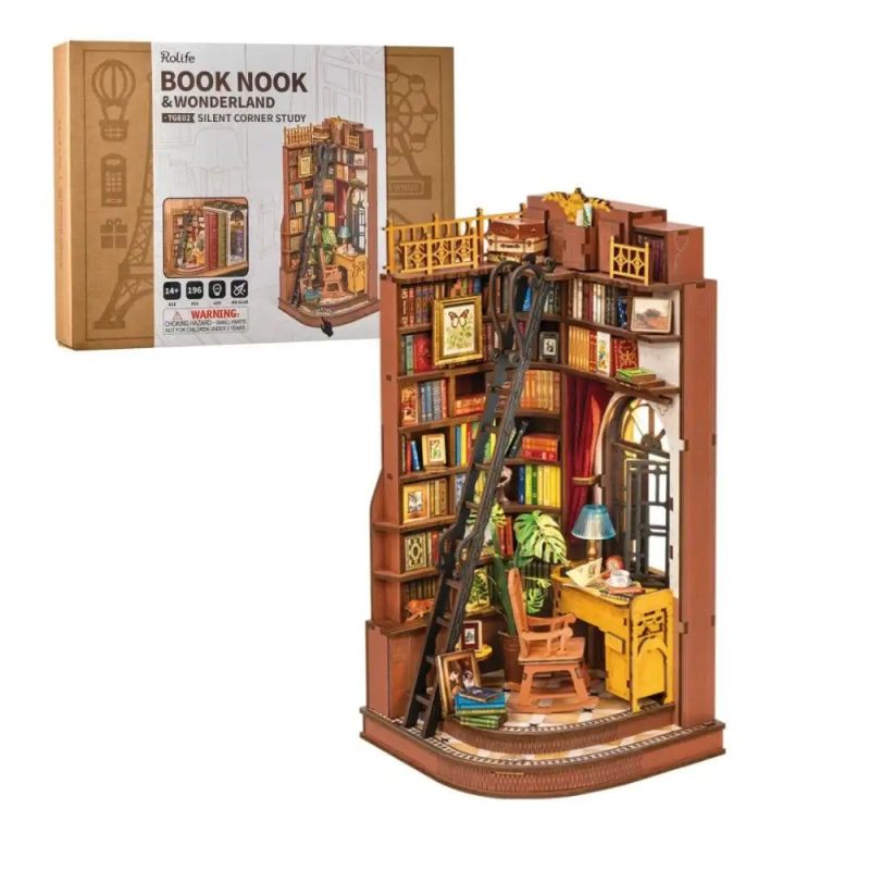 cozy-miniature-wooden-book-nook-with-a-study-scene Cozy miniature study scene with warm LED light, reading desk, and tiny lamp inside book nook