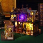 creative-build-your-own-treasure-home-with-warm-led-glow Build-your-own miniature treasure home kit with warm amber LED glow at dusk