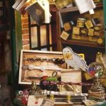 creative-miniature-house-project-kit-for-diy-enthusiasts Creative miniature house project kit showing step-by-step wand shop assembly stages
