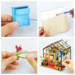 decorative-miniature-greenhouse-with-assembly-pieces Decorative miniature greenhouse with laser-cut assembly pieces laid out before build