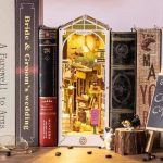 decorative-miniature-street-scene-for-bookcase-display Decorative miniature street scene book nook insert displayed in a bookcase with café details