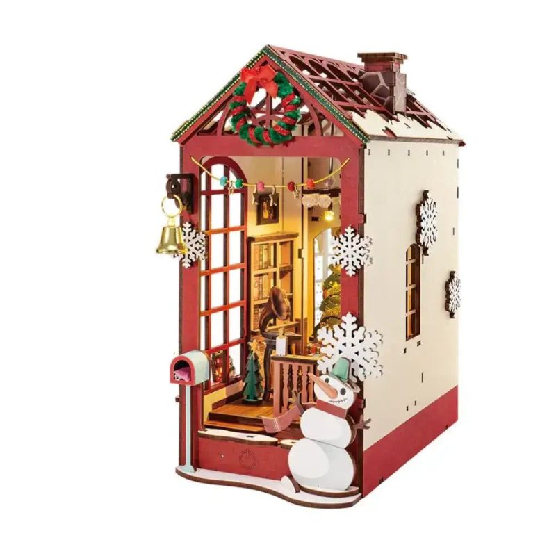 Detailed holiday diorama for book lovers display showing music box mechanism