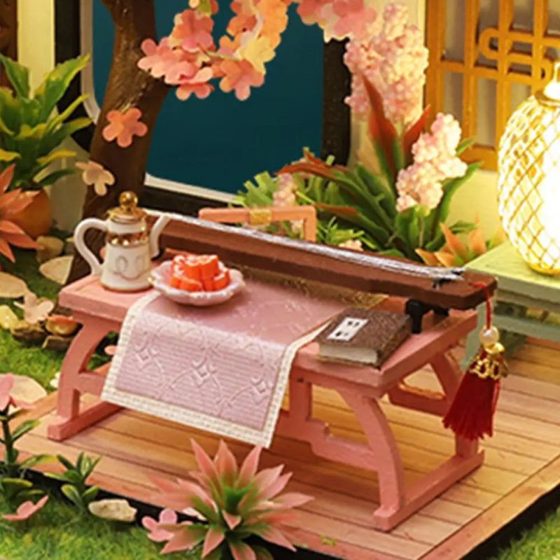 detailed-miniature-guqin-model-for-dollhouse-music-room Detailed miniature guqin model finished and displayed in dollhouse music room setting