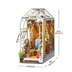 detailed-miniature-house-diorama-for-bookshelves Detailed miniature house diorama for bookshelves showing layered depth and interior glow