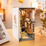 detailed-miniature-street-scene-book-nook-with-lanterns Detailed miniature street scene book nook with lanterns and cherry blossom canopy