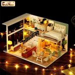 detailed-scale-model-diy-house-kit-for-hobbyists Detailed miniature house kit showing pre-cut wood panel assembly process and components