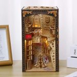 Diagon Alley miniature bookshelf diorama with layered storefronts