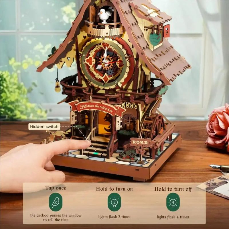 Dimensional wooden puzzle cuckoo clock model showing layered fretwork depth