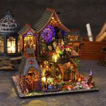 diy-fantasy-miniature-house-craft-kit-with-glowing-led-lights DIY fantasy miniature house craft kit showing warm glowing LED lights at dusk