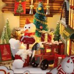 diy-holiday-book-nook-craft-kit DIY holiday book nook craft kit contents: wood pieces, paper details, figurines, music box mechanism