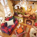 diy-miniature-christmas-house-assembly-kit-for-hobbyists DIY miniature Christmas house assembly kit components laid out showing pre-matched pieces for hobbyists