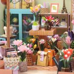 DIY miniature greenhouse craft kit with hand-painted botanical elements for hobbyists
