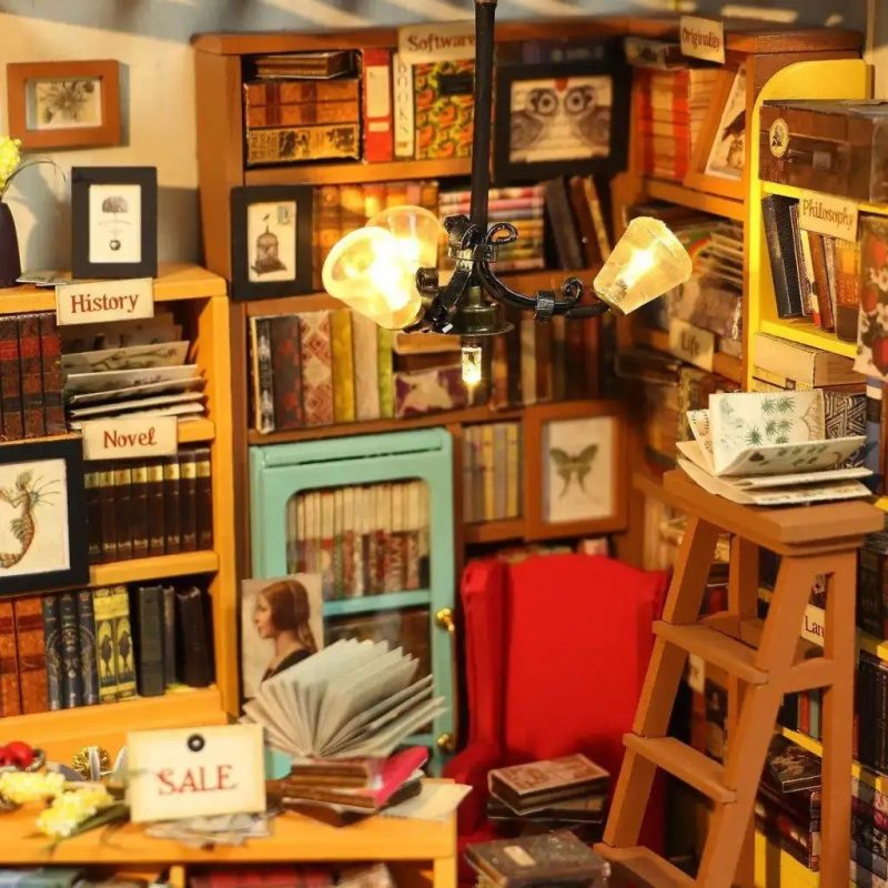 diy-miniature-house-interior-featuring-tiny-handcrafted-library DIY miniature house interior with handcrafted library shelves desk and lamp