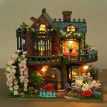 DIY miniature wooden fairy house showing curved bay windows and roofline detail