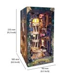 Enchanted cobblestone street book nook diorama displayed on wooden shelf