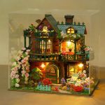 Fairy garden wooden cottage kit with floral vine accents and balcony