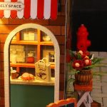 Foggy London shopfront miniature bookshelf insert with painted brick texture