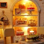 gingerbread-inspired-miniature-house-baking-decoration-set Cream and blush miniature house kit components showing bakery-themed decorative elements
