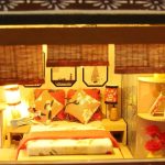 Hand-assembled Yaquan Court miniature dollhouse scene with tiny lamps and rugs lit