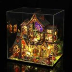 hand-painted-fantasy-dollhouse-model-with-battery-operated-leds Hand-painted fantasy dollhouse model with battery-operated LEDs casting amber shadows