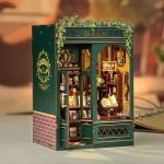 handcrafted-bookshop-shelf-scene-with-owl-figurine Handcrafted bookshop shelf scene with painted owl figurine and floral garland