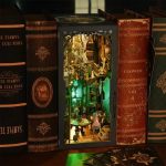 handcrafted-divination-book-nook-with-tarot-cards Handcrafted divination book nook showing miniature tarot cards and esoteric accessories