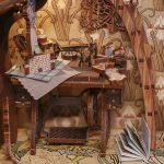handcrafted-elvish-miniature-scene-for-bookshelves Handcrafted elvish miniature scene with moss arch for bookshelves