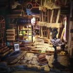 Handcrafted fantasy alley bookshelf insert with layered wooden shopfronts