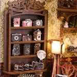 handcrafted-film-themed-miniature-bookshelf-scene Handcrafted film-themed miniature bookshelf scene with darkroom equipment details