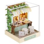 handcrafted-miniature-bakery-scene-for-dollhouse Handcrafted miniature bakery interior scene showing arranged pastry trays and counter fixture details