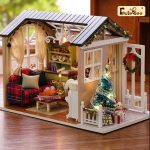 handcrafted-miniature-festive-home-with-detailed-furnishings Handcrafted miniature festive home with detailed ceramic furnishings and textile accents on display shelf
