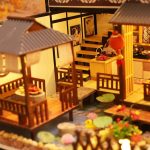 Miniature tea house model inspired by traditional Japanese architecture with sliding doors