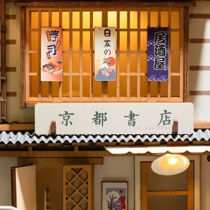 handcrafted-sakura-book-nook-bookshelf-decoration Handcrafted sakura book nook displayed as bookshelf decoration between novels