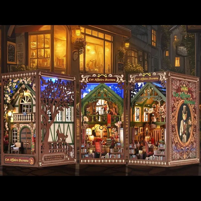 handcrafted-style-bookshelf-diorama-with-cats Handcrafted-style bookshelf diorama featuring laser-cut cat figures