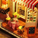 Handcrafted urban book nook with miniature cast-iron lamppost detail