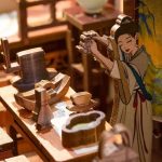 Handcrafted wooden book nook with intricate pagoda and architectural details