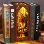 handcrafted-wooden-book-nook-with-tiny-books-and-warm-lighting Handcrafted wooden book nook with tiny stacked books and amber LED lighting