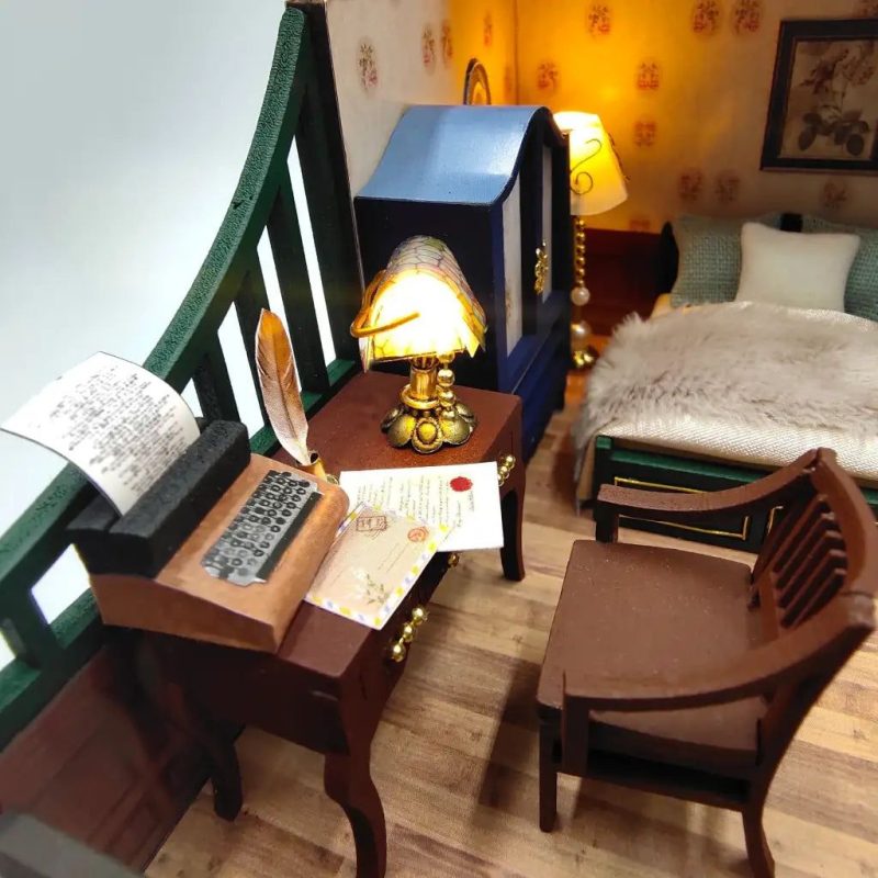 handmade-mini-house-craft-with-led-lights Handmade miniature cottage craft with warm interior lighting showing finished rooms