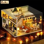 handmade-miniature-model-house-with-furniture Handmade miniature model house with detailed furniture arrangement and textile elements