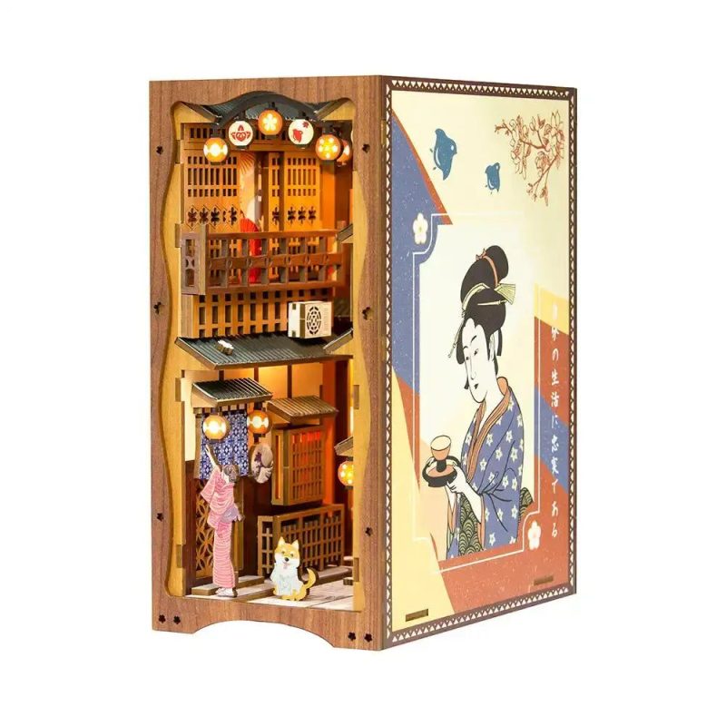 illuminated-miniature-bookshelf-scene-with-sakura illuminated miniature bookshelf scene with sakura petals and LED lantern lit