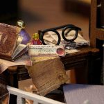 indoor-miniature-house-scene-with-ambient-lighting Completed miniature house scene on shelf with ambient warm LED lighting effect