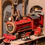 jacobite-train-miniature-bookshelf-insert-with-steampunk-time-machine-details Jacobite train miniature bookshelf insert showing steampunk archway and track details