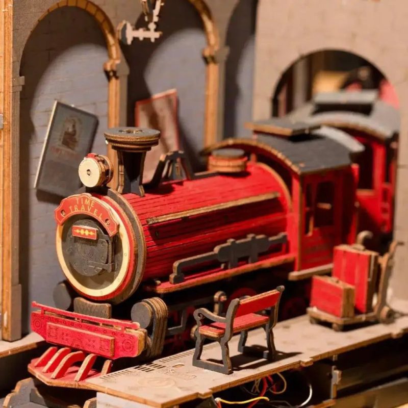 jacobite-train-miniature-bookshelf-insert-with-steampunk-time-machine-details Jacobite train miniature bookshelf insert showing steampunk archway and track details