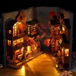 japanese-sakura-alley-mini-book-nook-diorama Japanese sakura alley miniature book nook diorama showing layered shopfront depth