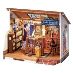 kiki-inspired-magical-miniature-dollhouse-craft-kit Kiki's inspired magical miniature dollhouse craft kit showing glowing windows, detailed interior, and brass hardware