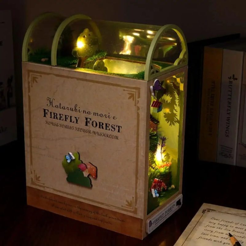 led-lit-forest-diorama-for-cozy-reading-corners LED-lit forest diorama casting soft dappled shadows in cozy reading corner near window
